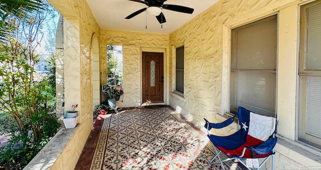 entrance to property featuring ceiling fan