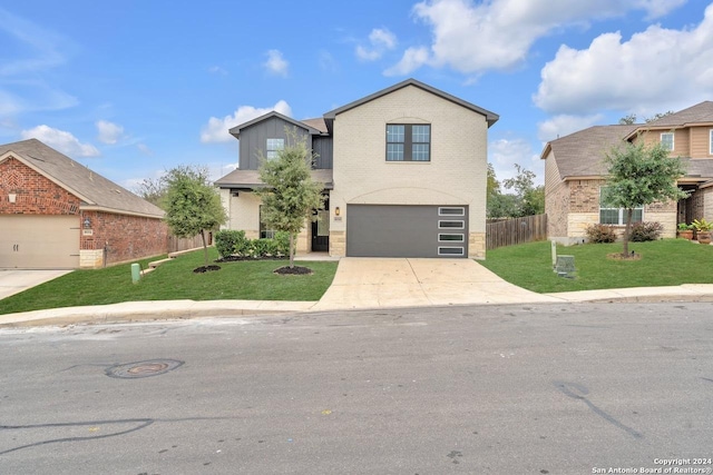 front of property with a garage and a front yard