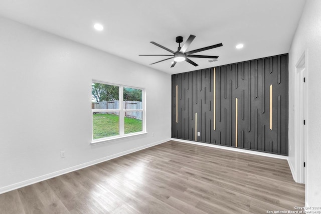 spare room featuring ceiling fan and wood-type flooring