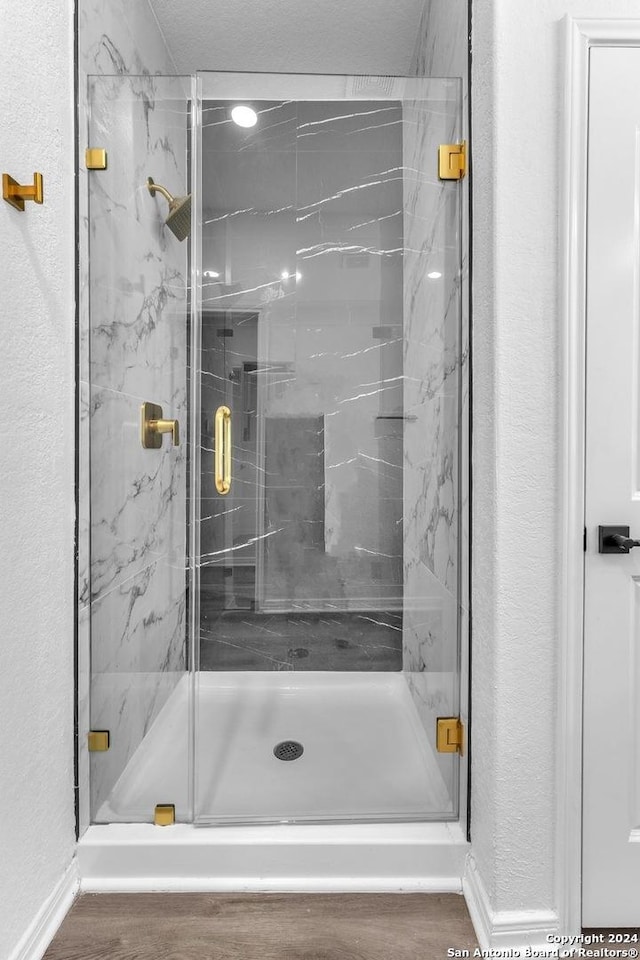 bathroom with an enclosed shower