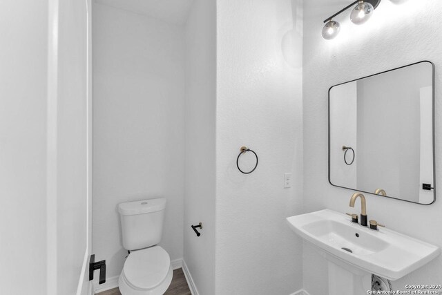 bathroom with sink and toilet