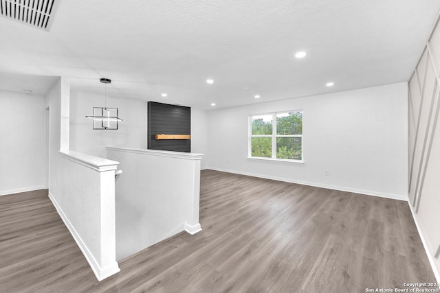 interior space featuring wood-type flooring and a fireplace