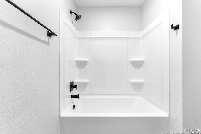 bathroom with shower / washtub combination