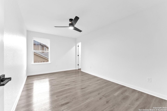 unfurnished room featuring ceiling fan and wood-type flooring