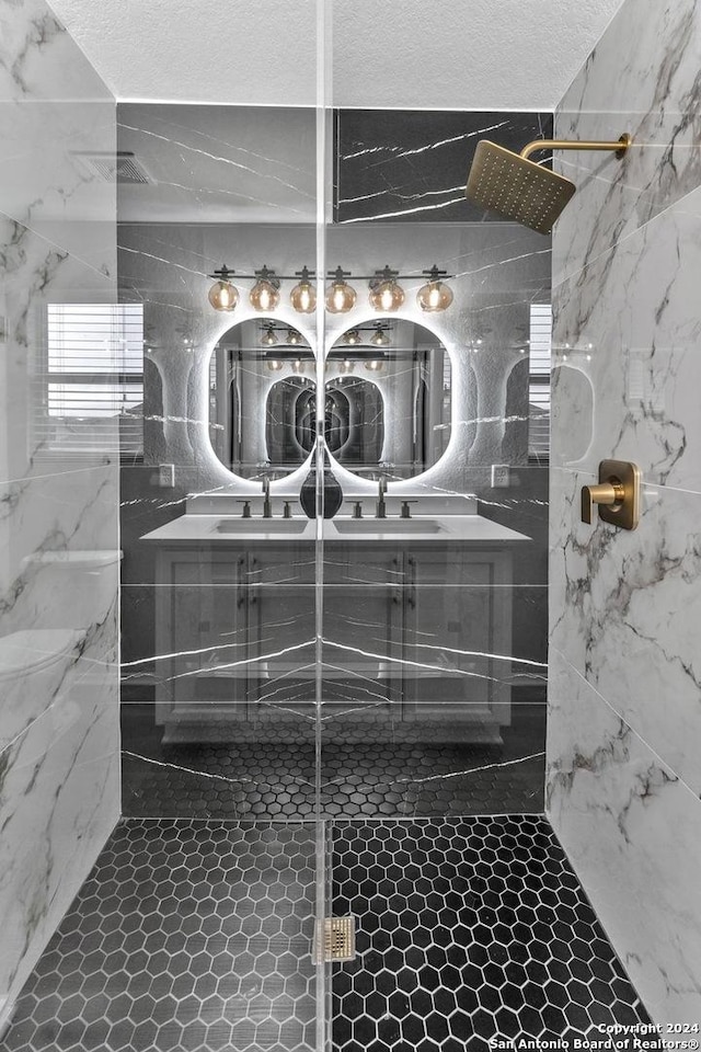 details featuring a textured ceiling and tiled shower