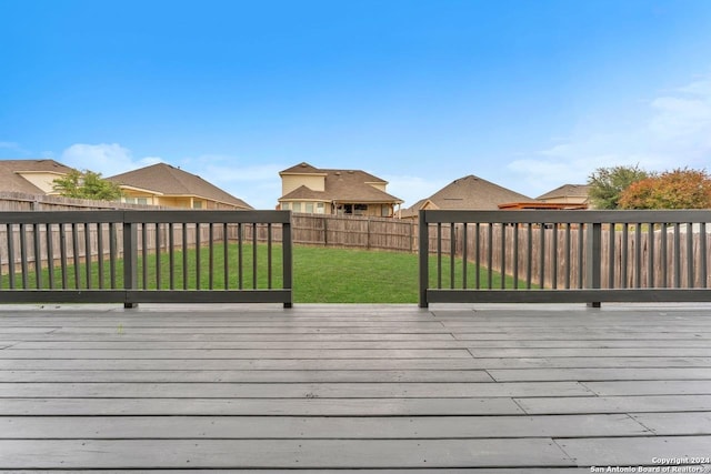 wooden terrace with a yard