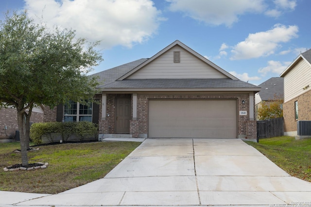 view of front of property featuring a front lawn and a garage