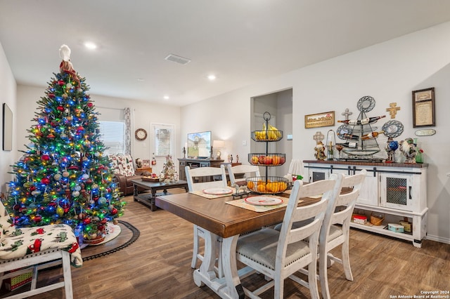 dining space with light hardwood / wood-style floors