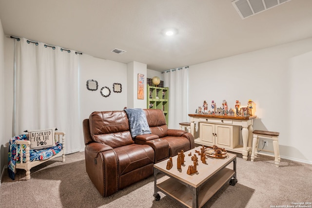 living room featuring light colored carpet and bar area