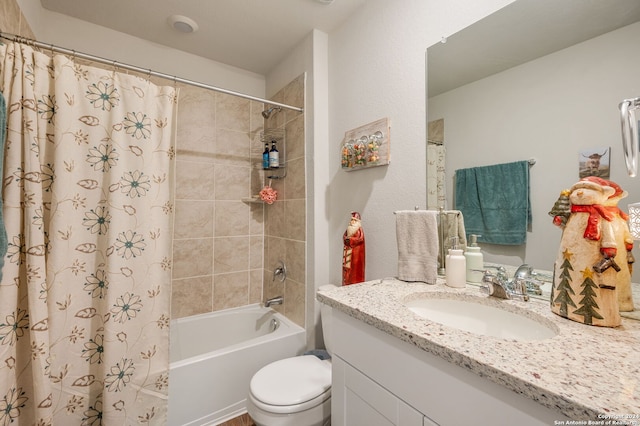 full bathroom featuring vanity, toilet, and shower / bath combo with shower curtain