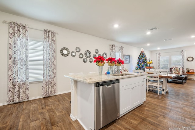 kitchen featuring white cabinets, dishwasher, dark hardwood / wood-style flooring, and an island with sink