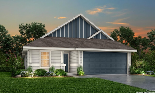 view of front facade featuring a garage and a lawn