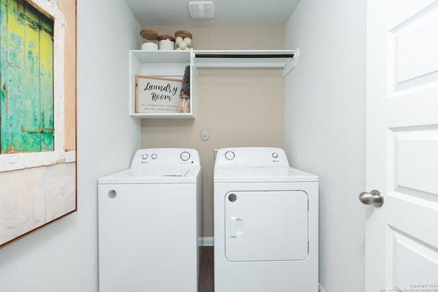 clothes washing area featuring independent washer and dryer