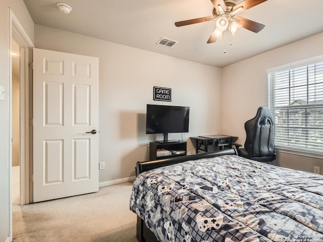 bedroom featuring ceiling fan and light colored carpet