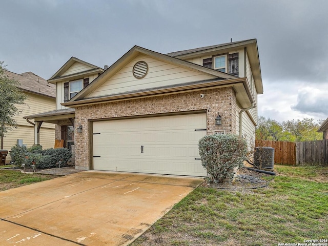 view of front of house with central AC unit and a garage