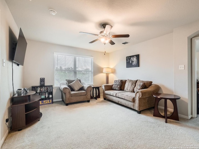 living room featuring ceiling fan and carpet floors