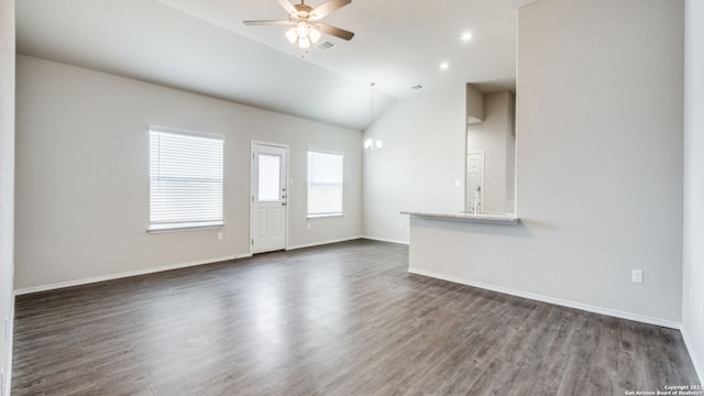 unfurnished living room featuring ceiling fan, dark hardwood / wood-style flooring, and lofted ceiling