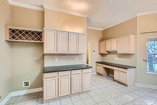 kitchen with light brown cabinetry, light tile patterned flooring, and ornamental molding