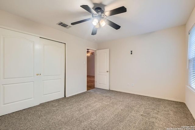 unfurnished bedroom featuring carpet flooring, a closet, and ceiling fan