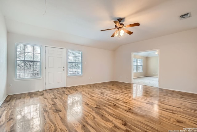 entrance foyer with ceiling fan, light wood-type flooring, and vaulted ceiling