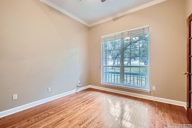 empty room with light hardwood / wood-style floors, ceiling fan, and ornamental molding