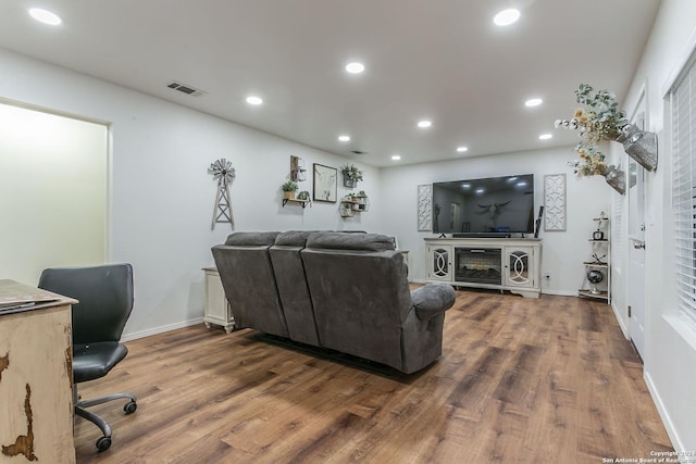 living room with dark hardwood / wood-style flooring