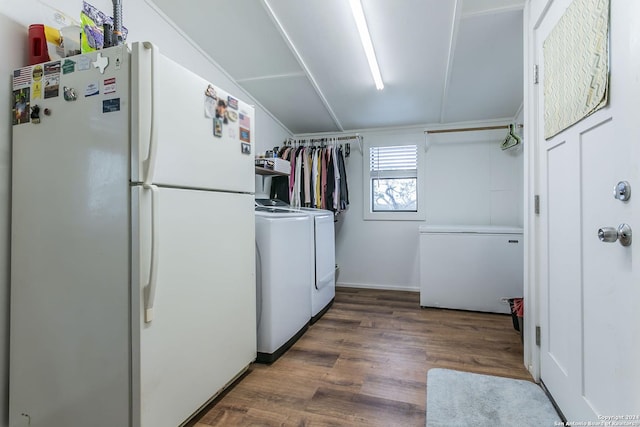 washroom with washing machine and dryer and dark wood-type flooring