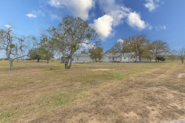 view of yard with a rural view