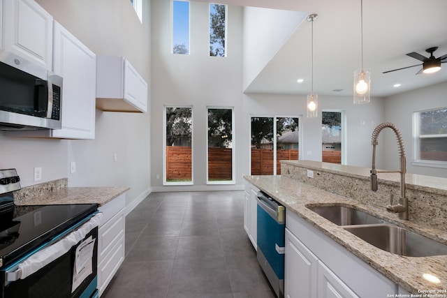 kitchen with white cabinetry, sink, and appliances with stainless steel finishes