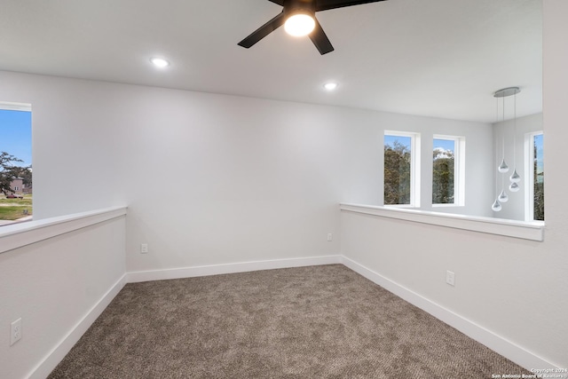 carpeted empty room with ceiling fan