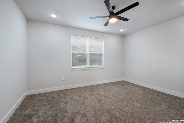 carpeted empty room with ceiling fan