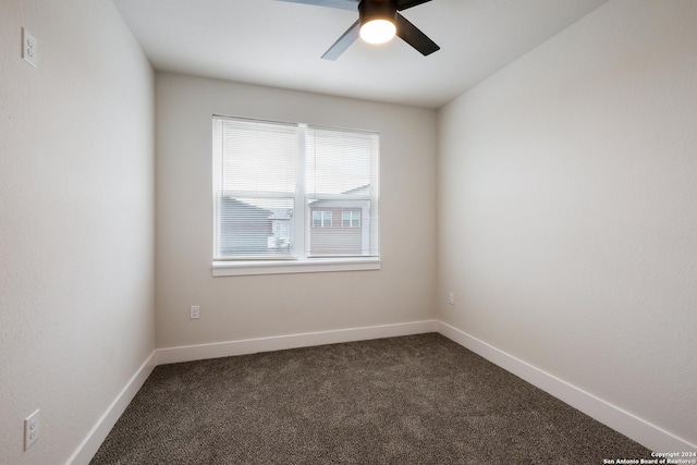 spare room featuring ceiling fan and carpet floors