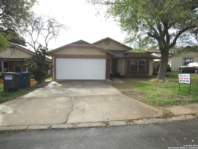 single story home featuring a garage