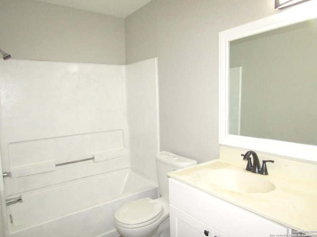 full bathroom with vanity, toilet, and washtub / shower combination