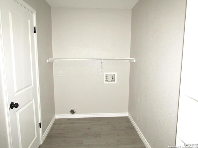 washroom featuring hookup for a washing machine and dark hardwood / wood-style floors