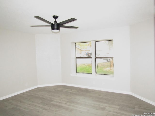 unfurnished room featuring ceiling fan and wood-type flooring