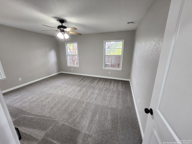 unfurnished room featuring carpet floors and ceiling fan