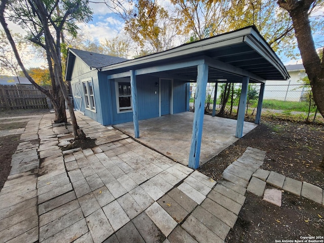 view of patio featuring a carport