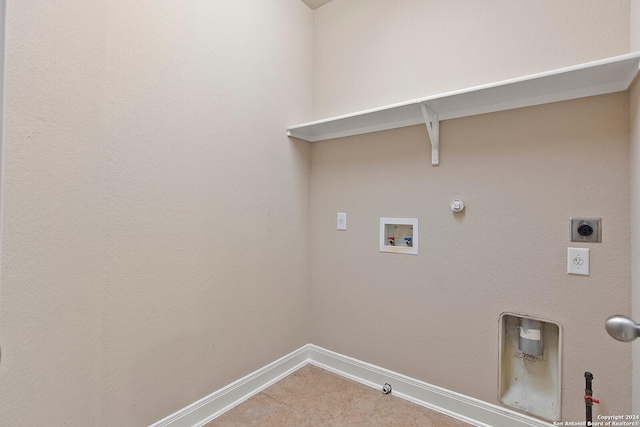 washroom with tile patterned floors, gas dryer hookup, washer hookup, and hookup for an electric dryer