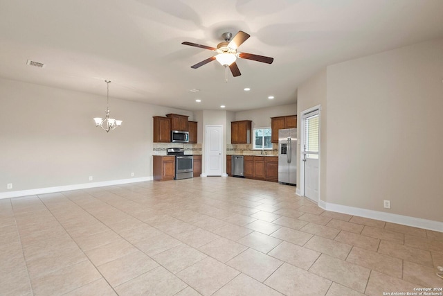 interior space with sink, ceiling fan with notable chandelier, and light tile patterned flooring