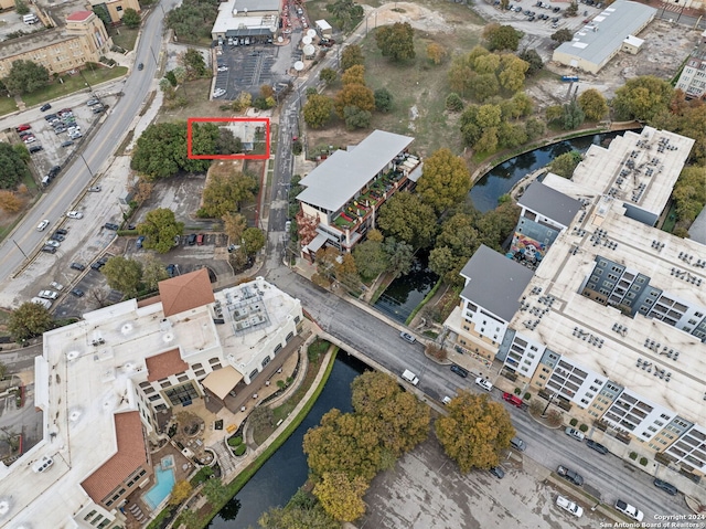 birds eye view of property with a water view