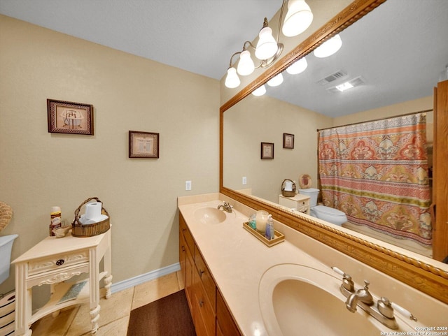 bathroom with tile patterned floors, a shower with curtain, vanity, and toilet