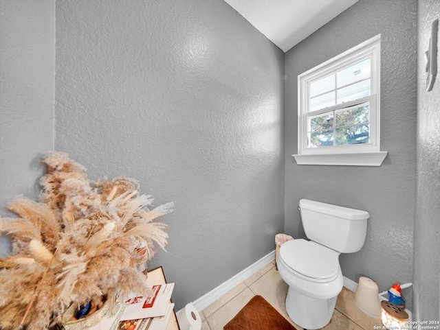 bathroom with tile patterned floors and toilet