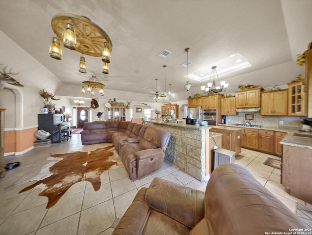 tiled living room with a chandelier