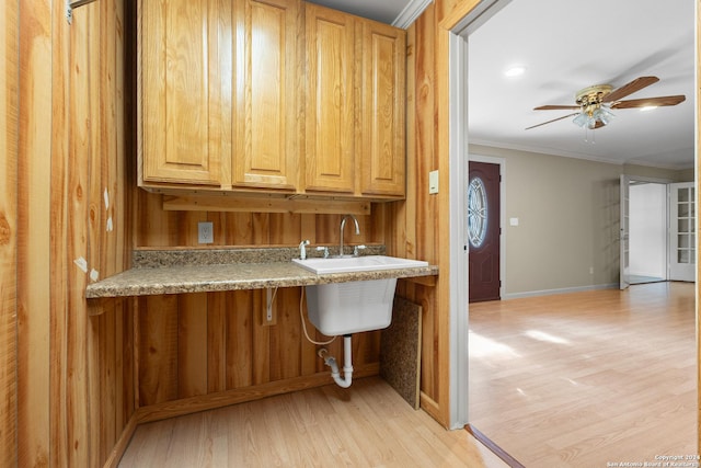 kitchen with light hardwood / wood-style flooring, ceiling fan, and crown molding