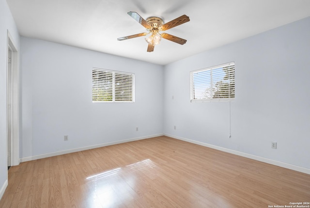 unfurnished room featuring ceiling fan and light wood-type flooring