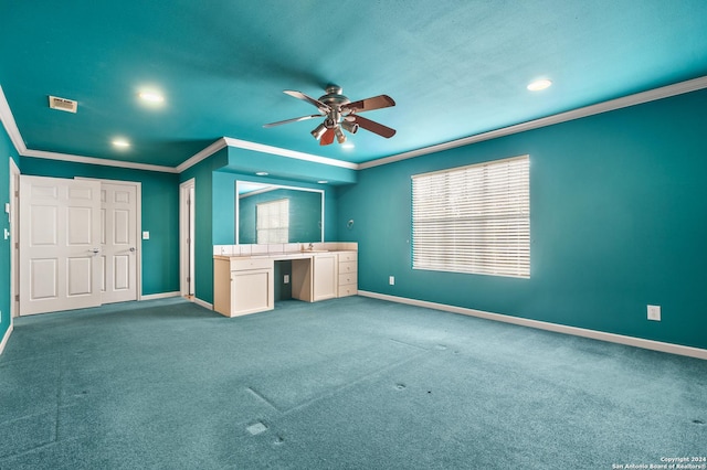 unfurnished living room with carpet floors, plenty of natural light, crown molding, and ceiling fan