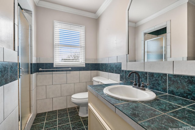 bathroom featuring tile patterned floors, an enclosed shower, tile walls, and ornamental molding