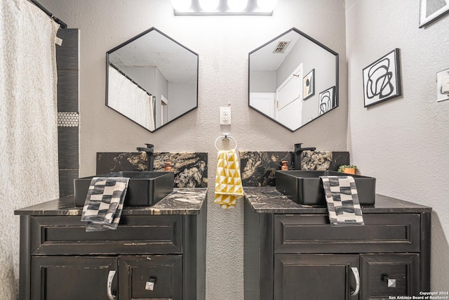 interior space with dark brown cabinetry and sink