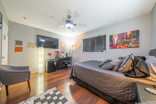 bedroom featuring ceiling fan and wood-type flooring